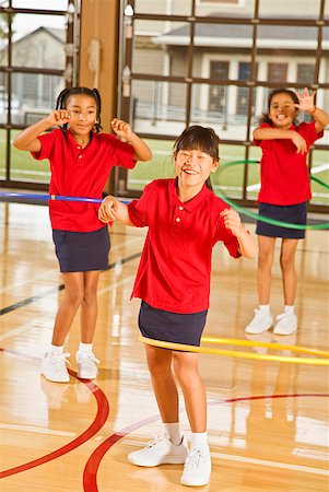 school and uniform and african - Multi-ethnic girls playing with hula hoops Stock Photo - Premium Royalty-Free, Code: 673-02143722