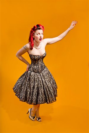 pin up - Femme portant robe de soirée sans bretelles Photographie de stock - Premium Libres de Droits, Code: 673-02143747