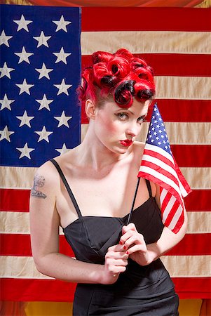 pin up - Woman holding American flag Stock Photo - Premium Royalty-Free, Code: 673-02143764