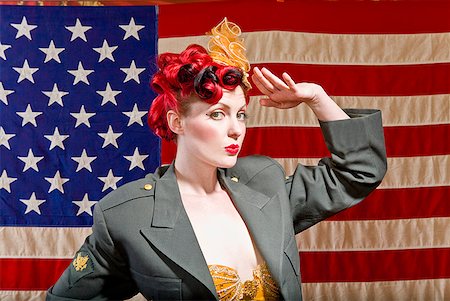 showgirls - Woman wearing military jacket and saluting Stock Photo - Premium Royalty-Free, Code: 673-02143766