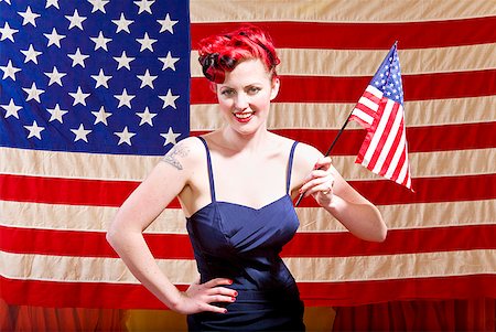 pin up - Woman holding American flag Stock Photo - Premium Royalty-Free, Code: 673-02143763