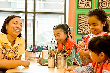 African female art teacher and students in classroom Stock Photo - Premium Royalty-Free, Code: 673-02143813
