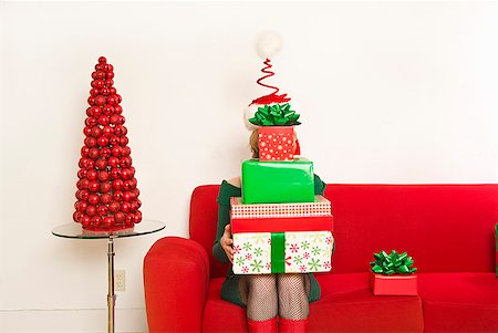 simsearch:673-02143816,k - Woman holding stack of Christmas gifts Stock Photo - Premium Royalty-Free, Code: 673-02143833