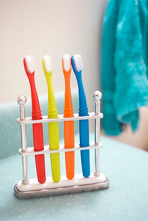 Assorted colorful toothbrushes in stand Stock Photo - Premium Royalty-Free, Code: 673-02216487