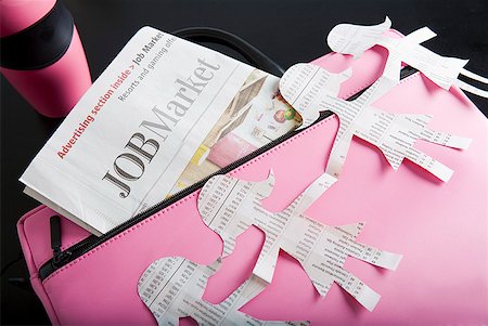 pink paper - Paper dolls, briefcase and employment section of newspaper Stock Photo - Premium Royalty-Free, Code: 673-02216495