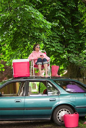 picnic people sitting top view - Woman picnicking on top of car Stock Photo - Premium Royalty-Free, Code: 673-02216558