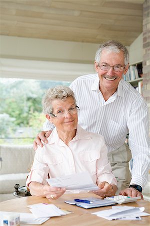 Couple preparing home finance budget Stock Photo - Premium Royalty-Free, Code: 673-02386276