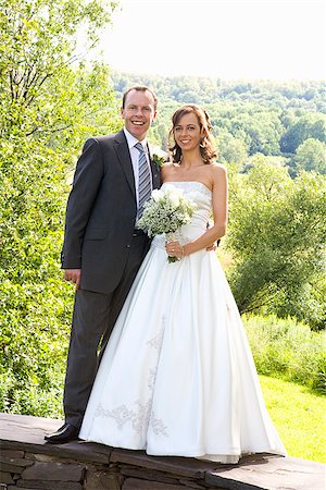 Newlywed couple standing together East Meredith, New York State, USA Foto de stock - Sin royalties Premium, Código: 673-02386640