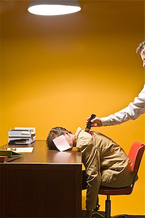 simsearch:673-02801407,k - Woman in office being stabbed in the back Stock Photo - Premium Royalty-Free, Code: 673-02801409