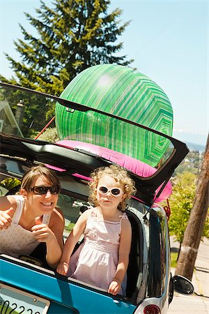 Woman with girl in back of smart car Stock Photo - Premium Royalty-Free, Code: 673-03005536