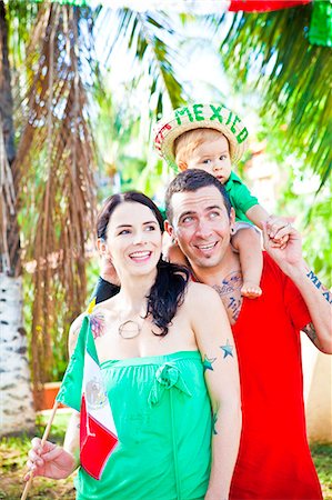 family portrait with flags - tattoed mom and dad with baby Stock Photo - Premium Royalty-Free, Code: 673-03405709