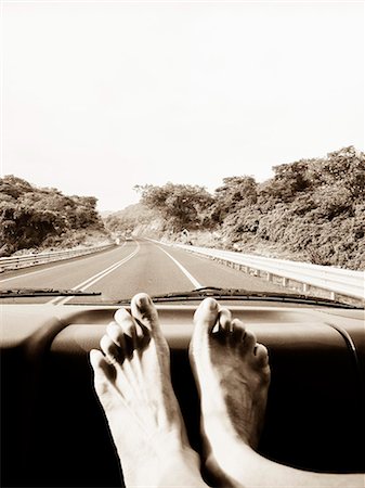 dashboard in car - feet on car dashboard Stock Photo - Premium Royalty-Free, Code: 673-03405792
