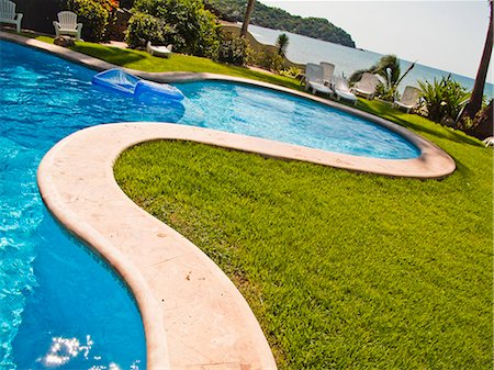 deck chair swimming pool nobody - pool in mexico resort Stock Photo - Premium Royalty-Free, Code: 673-03405807
