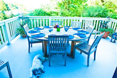 deck chair railing - outdoor table set for dinner Stock Photo - Premium Royalty-Free, Code: 673-03405827