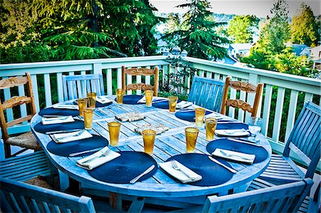deck chair railing - outdoor table set for dinner Stock Photo - Premium Royalty-Free, Code: 673-03405831