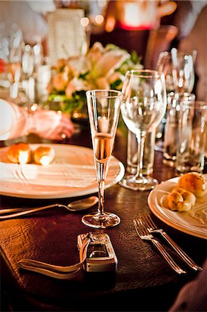 sparkling wine - camera on set table Stock Photo - Premium Royalty-Free, Code: 673-03623194