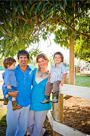 smiling family portrait closeup - portrait of family outdoors Stock Photo - Premium Royalty-Free, Code: 673-03623198