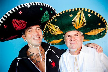 sombrero - portrait of two men wearing sombreros Fotografie stock - Premium Royalty-Free, Codice: 673-03623217