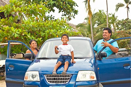 young mexican family with car Stock Photo - Premium Royalty-Free, Code: 673-03623239