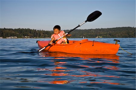 red indian - boy kayaking in puget sound Stock Photo - Premium Royalty-Free, Code: 673-03826310