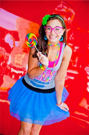 teen girl with large lollipop Foto de stock - Sin royalties Premium, Código: 673-03826327