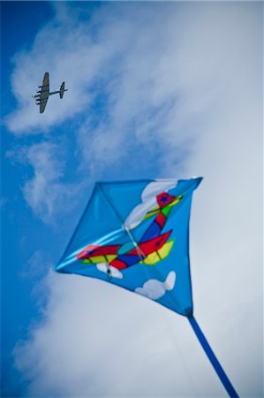 kite flying under wwii bomber Stock Photo - Premium Royalty-Free, Code: 673-03826368