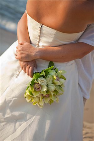 romantic wedding flower - bridal couple hugging on beach Stock Photo - Premium Royalty-Free, Code: 673-03826524
