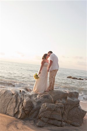 bridal couple hugging on beach Stock Photo - Premium Royalty-Free, Code: 673-03826529