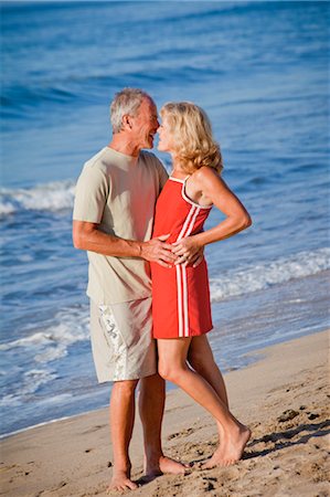 middle aged couple hugging on beach Stock Photo - Premium Royalty-Free, Code: 673-03826577