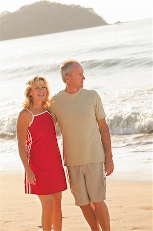 middle aged couple hugging on beach Stock Photo - Premium Royalty-Free, Code: 673-03826578
