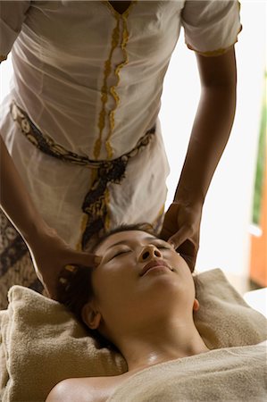 simsearch:685-02937230,k - Young woman having head massage Stock Photo - Premium Royalty-Free, Code: 685-02937246