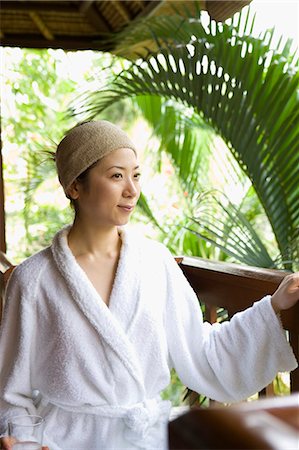 simsearch:685-02937281,k - Young woman sitting on deck Stock Photo - Premium Royalty-Free, Code: 685-02937297