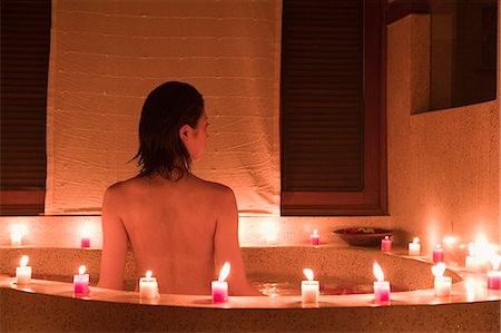 simsearch:685-02937281,k - Young woman taking bath with flower petals Stock Photo - Premium Royalty-Free, Code: 685-02937291