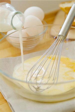 eggs milk - Pouring milk into bowl Stock Photo - Premium Royalty-Free, Code: 685-02937347