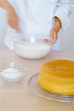 A woman mixing cream, blurred motion Stock Photo - Premium Royalty-Free, Code: 685-02937939