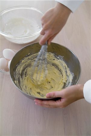 A woman mixing flour and egg Stock Photo - Premium Royalty-Free, Code: 685-02937930