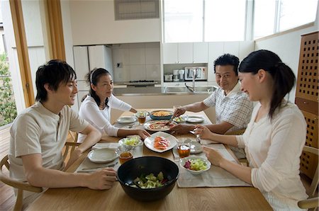 family asian lunch - Family eating lunch at home Stock Photo - Premium Royalty-Free, Code: 685-02938151
