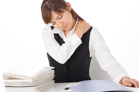 simsearch:685-02938526,k - A young woman massaging shoulder Stock Photo - Premium Royalty-Free, Code: 685-02938547