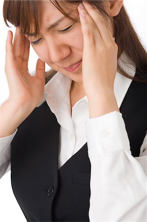 simsearch:685-02938526,k - A young woman suffering from headache Stock Photo - Premium Royalty-Free, Code: 685-02938552