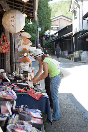 Two young women looking at souvenirs Stock Photo - Premium Royalty-Free, Code: 685-02938700