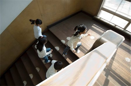 Children running up staircase Stock Photo - Premium Royalty-Free, Code: 685-02938788