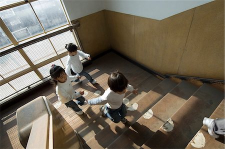 Children running up staircase Stock Photo - Premium Royalty-Free, Code: 685-02938789