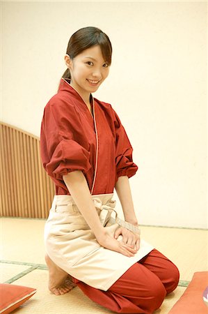 Portrait of young waitress sitting at Japanese restaurant Stock Photo - Premium Royalty-Free, Code: 685-02938834