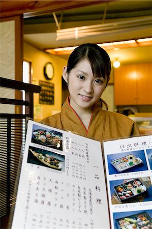 simsearch:685-02938871,k - Waitress showing menu at Japanese restaurant Foto de stock - Sin royalties Premium, Código: 685-02938848