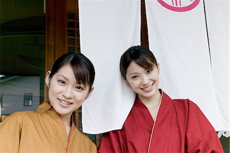 simsearch:685-02938851,k - Two young women standing in front of restaurant Stock Photo - Premium Royalty-Free, Code: 685-02938854