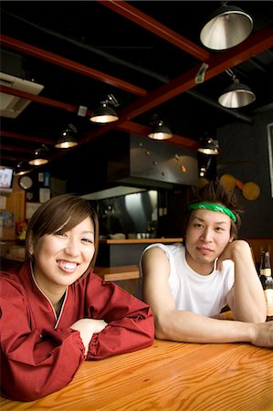 simsearch:685-02938851,k - Young man and woman sitting at table Stock Photo - Premium Royalty-Free, Code: 685-02938867