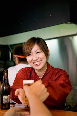 simsearch:685-02938851,k - Waitress receiving a glass of beer Stock Photo - Premium Royalty-Free, Code: 685-02938861