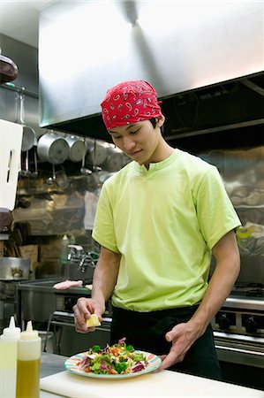 simsearch:685-02938851,k - Young man making salad Stock Photo - Premium Royalty-Free, Code: 685-02938942