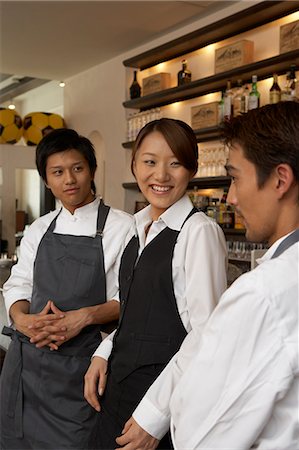 Chefs and waitress talking Stock Photo - Premium Royalty-Free, Code: 685-02938979