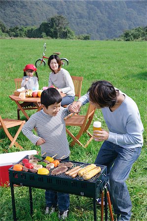 family in mountain picnic - Family having barbeque Stock Photo - Premium Royalty-Free, Code: 685-02939074